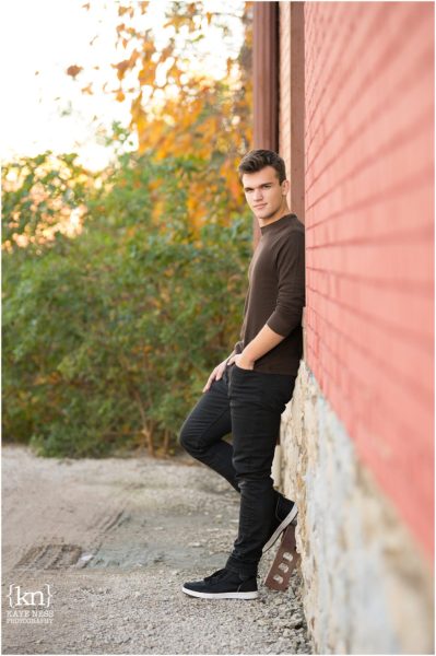 male poses for high school seniors